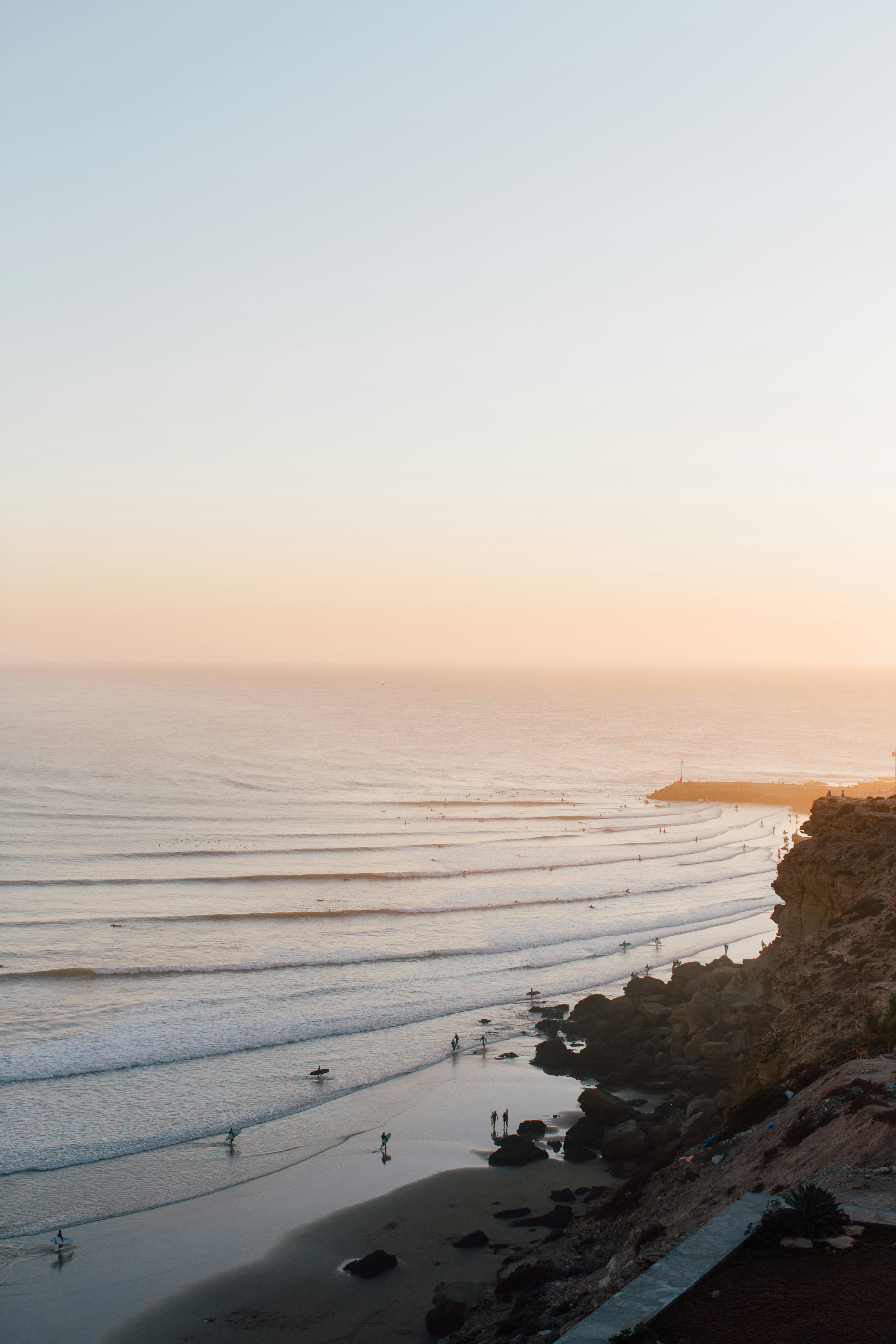 brown rock formation on sea during daytime